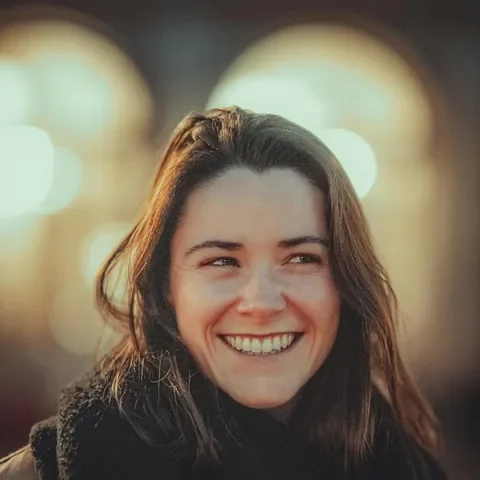 A smiling woman outdoors